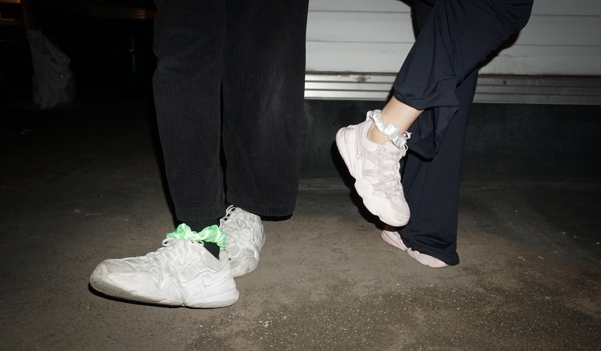Friends' feet dancing on a rooftop in Chelsea, New York.